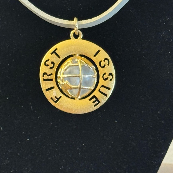 VTG G/T pendant featuring spinning globe w/text “First Issue” on outer ring - Picture 5 of 7